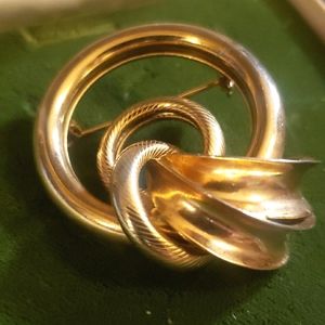 Gold tone Mid-century Modern Rings and Ribbon Brooch